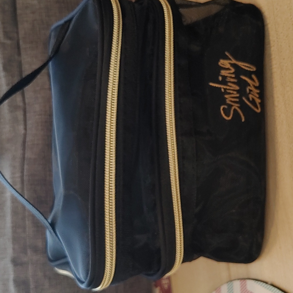 NWOT SHEER COSMETIC BAG (SMILING GIRL)